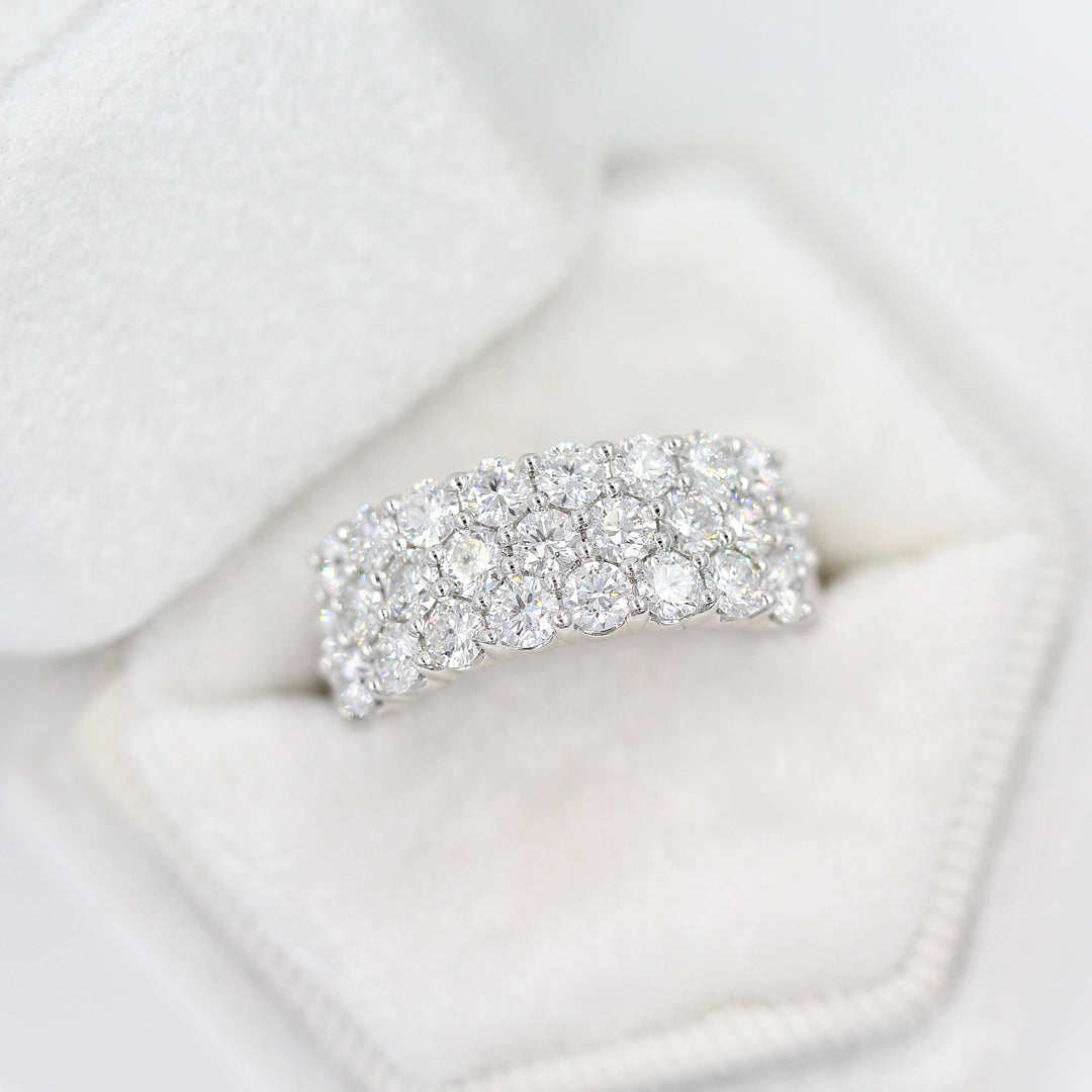 The Harmony Wedding Band in White Gold in a white velvet ring box