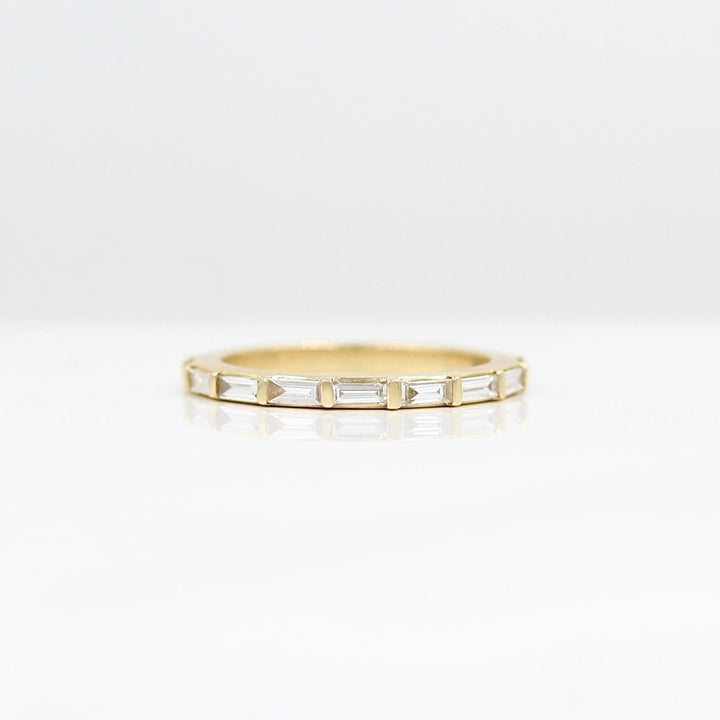 The Horizon Wedding Band in Yellow Gold against a white background