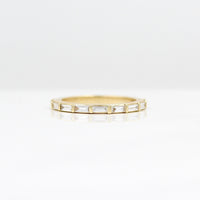 The Horizon Wedding Band in Yellow Gold against a white background