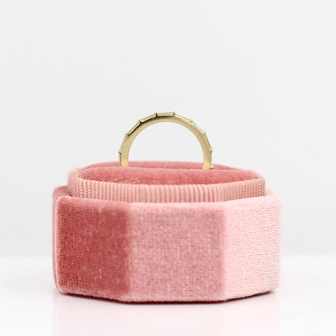 The Horizon Wedding Band in Yellow Gold in a pink velvet ring box