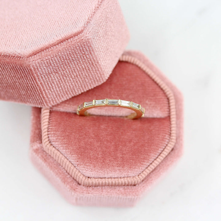 The Horizon Wedding Band in Yellow Gold in a pink velvet ring box
