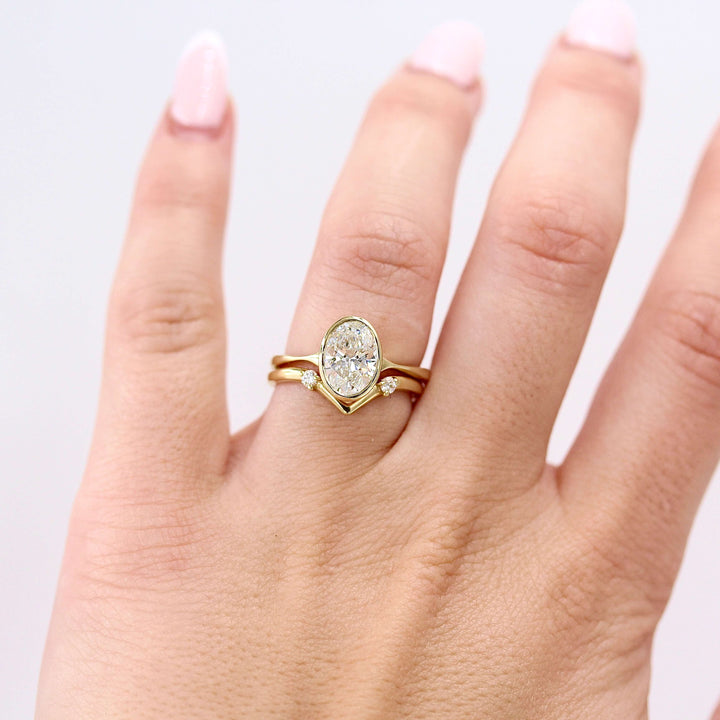 Ready to Ship Ring 14k Yellow Gold The Stevie Ring (Oval) in Yellow Gold with 1.54ct Lab Grown Diamond stacked with the Double Diamond V wedding band in yellow gold modeled