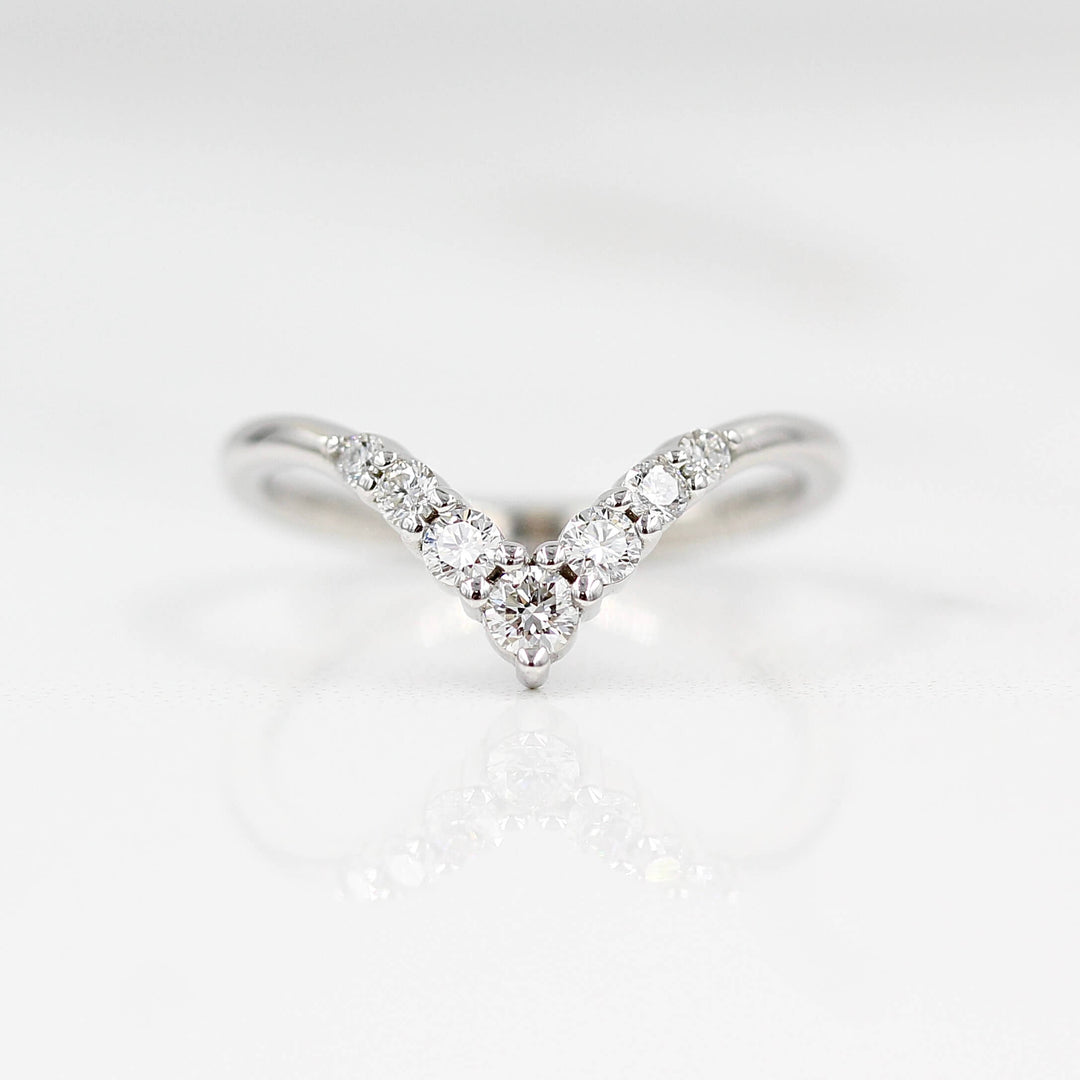 The Graduated Diamond V-Band in white gold against a white background