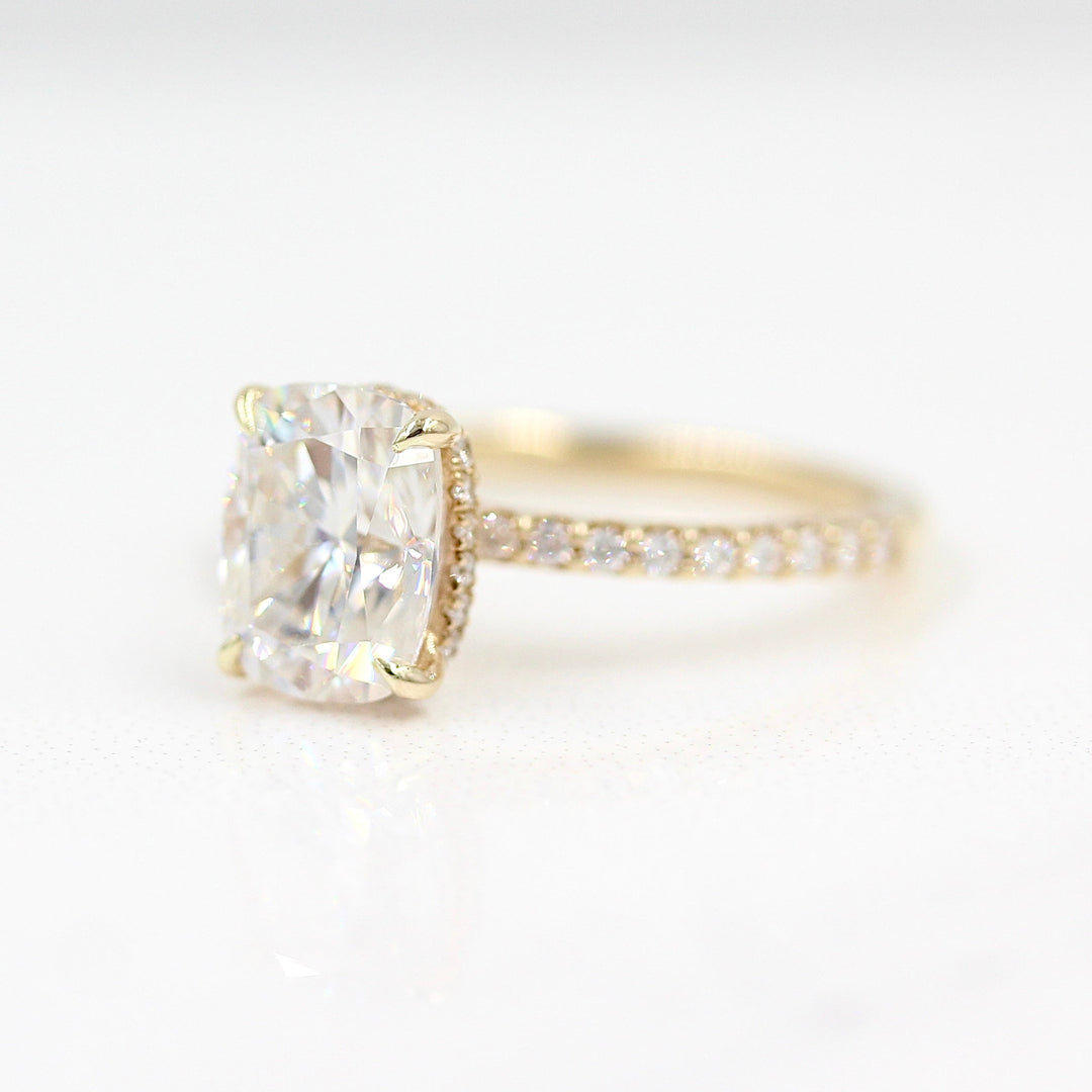 The Paris Hidden Halo Ring in Yellow Gold with 2ct Moissanite against a white background