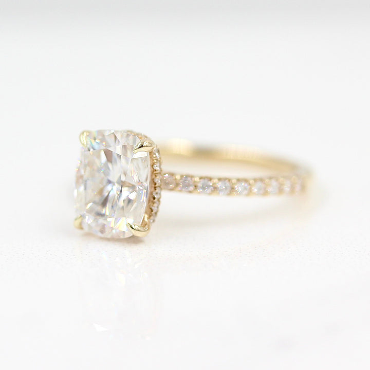 The Paris Hidden Halo Ring in Yellow Gold with 2ct Moissanite against a white background