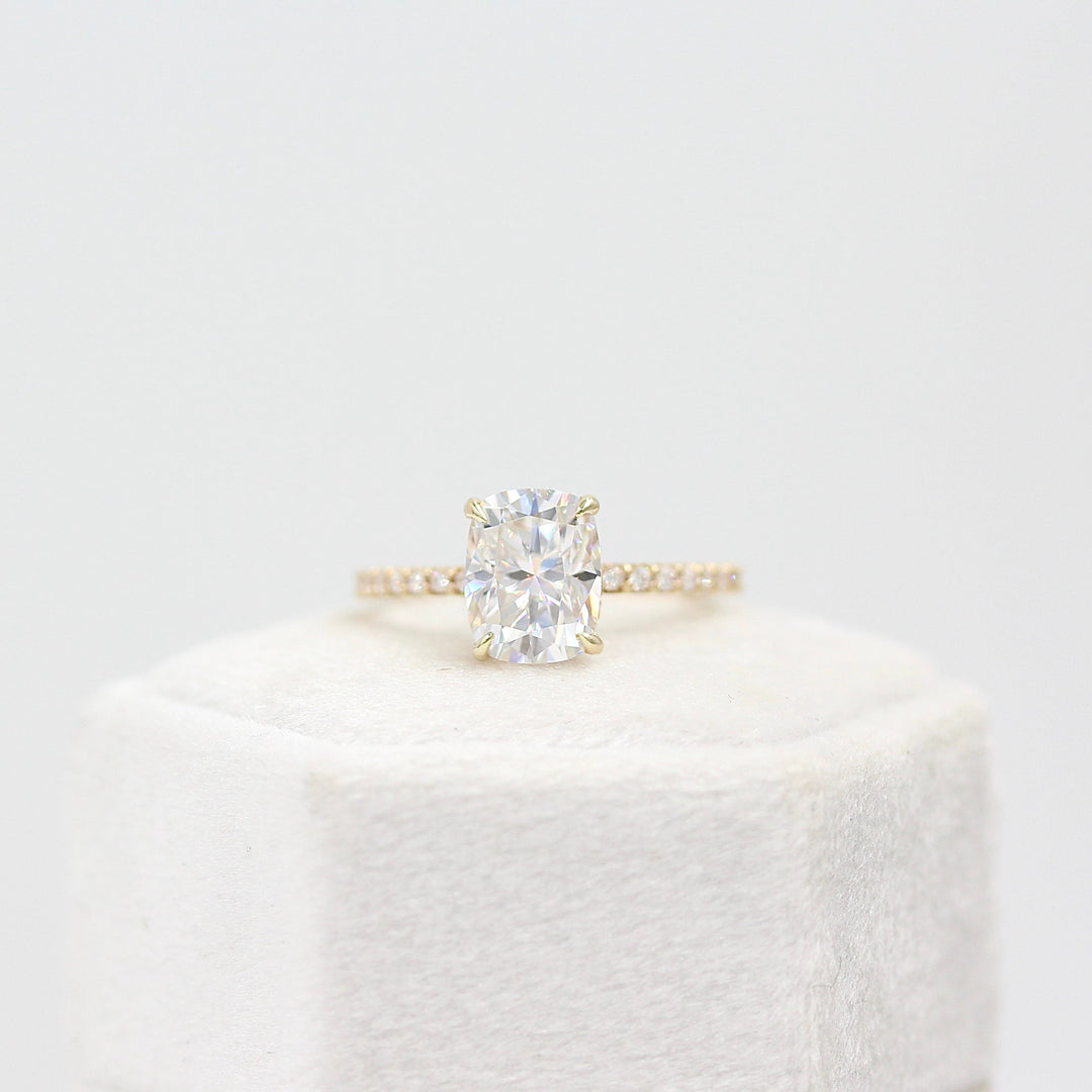 The Paris Hidden Halo Ring in Yellow Gold with 2ct Moissanite atop of a white background