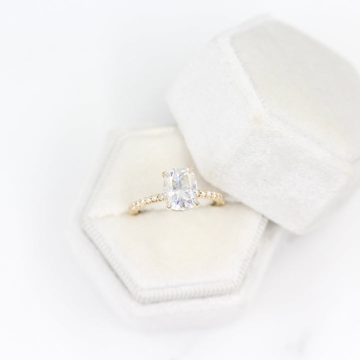 The Paris Hidden Halo Ring in Yellow Gold with 2ct Moissanite in a white velvet ring box