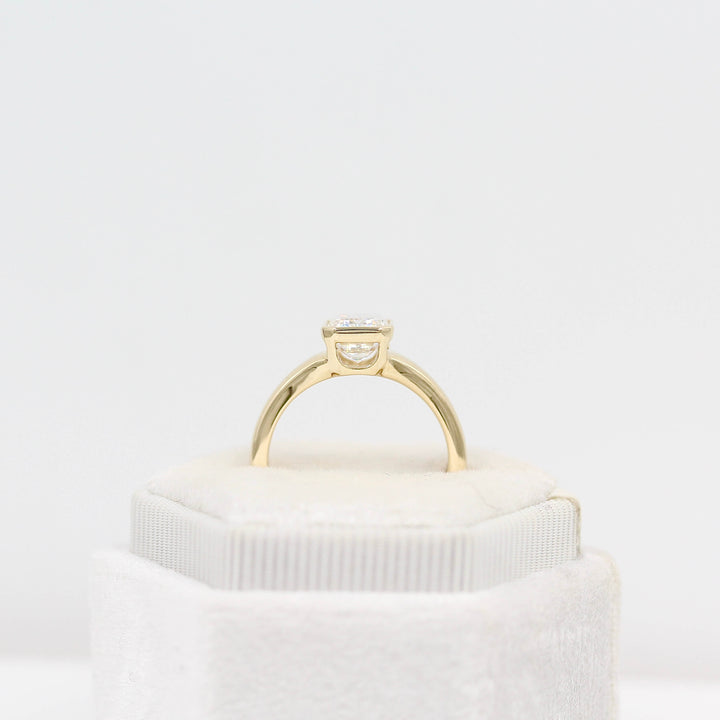 The Billie Ring in yellow gold in a white velvet ring box