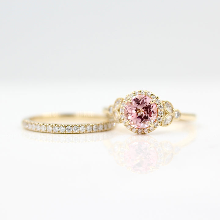 The Cate ring (round) with peachy-pink sapphire in yellow gold with the Elizabeth wedding band in yellow gold