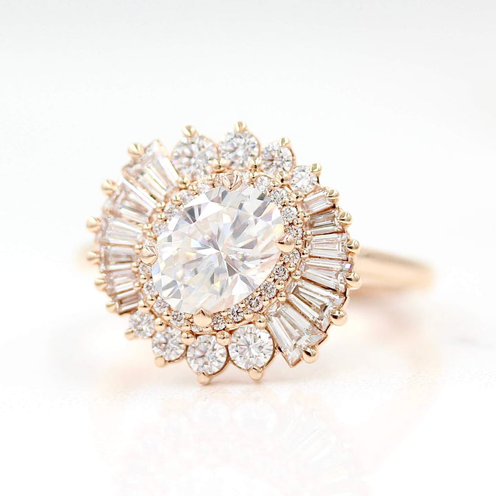 The Soleil Ring in Rose Gold and Moissanite against a white background