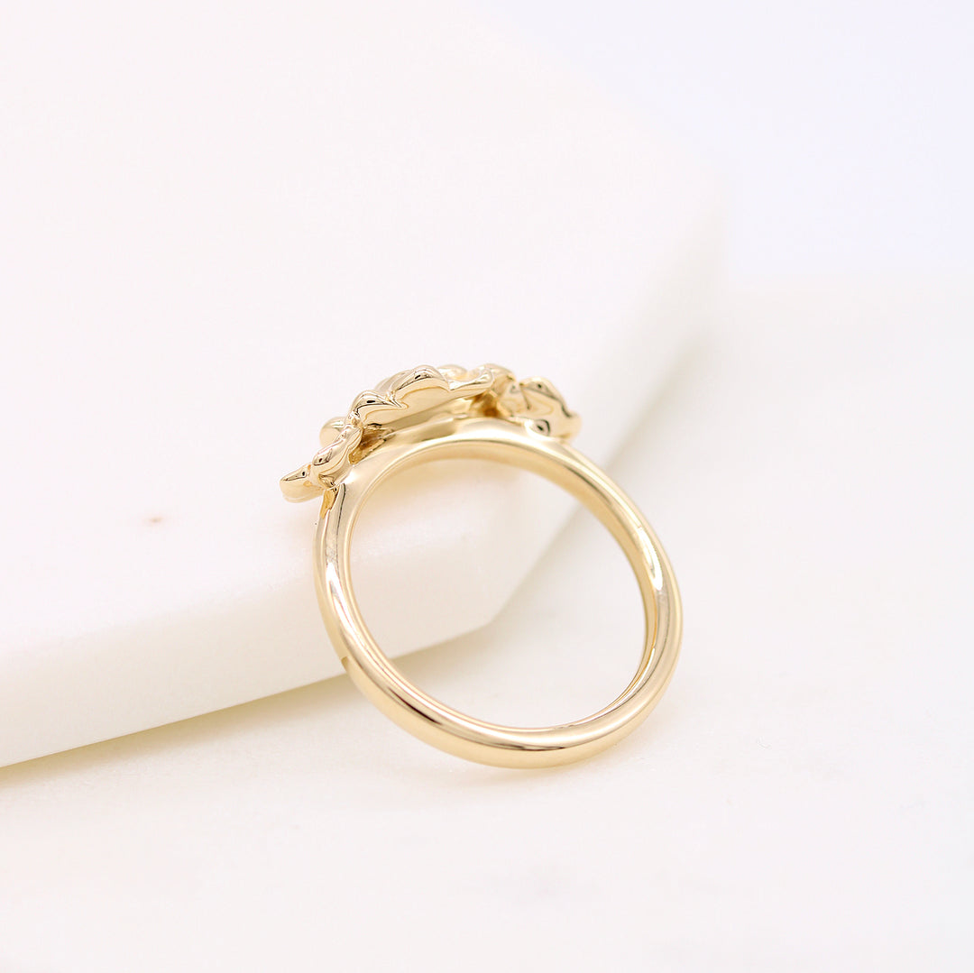 The Posy ring in yellow gold against a white background