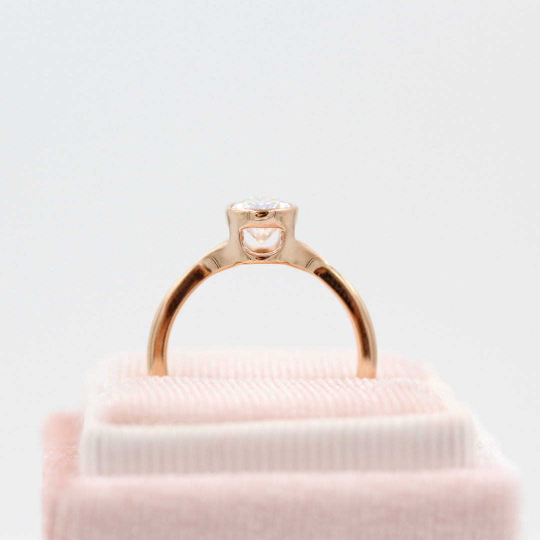 Stevie ring (pear) in rose gold side profile in velvet pink ring box