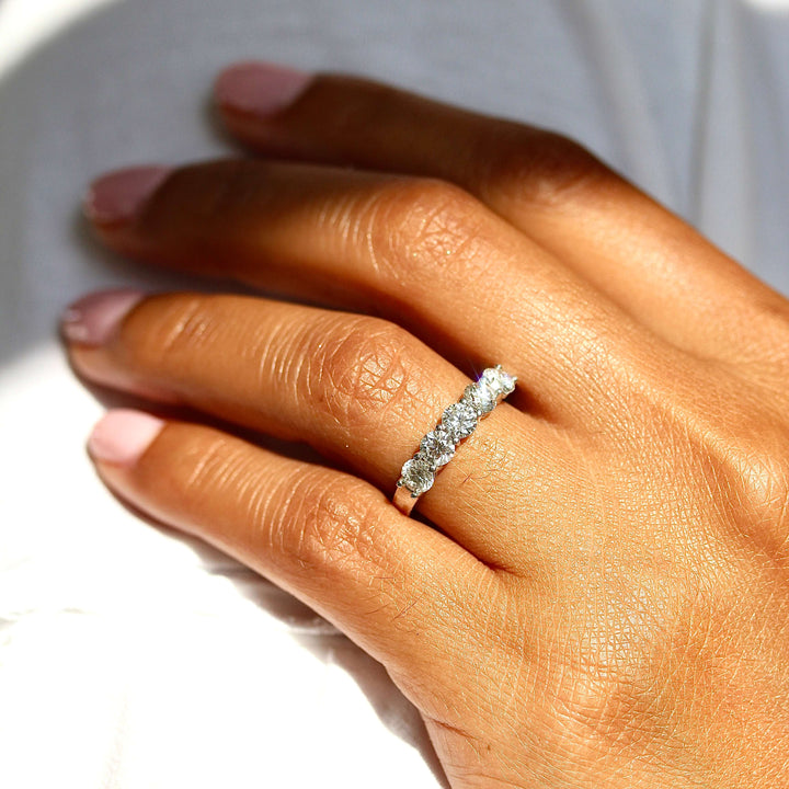 The Elisa Wedding Band in White Gold modeled on a hand