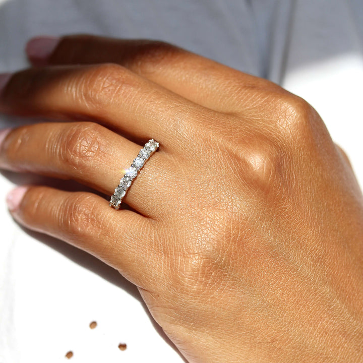 hand wearing the 10-stone wedding band