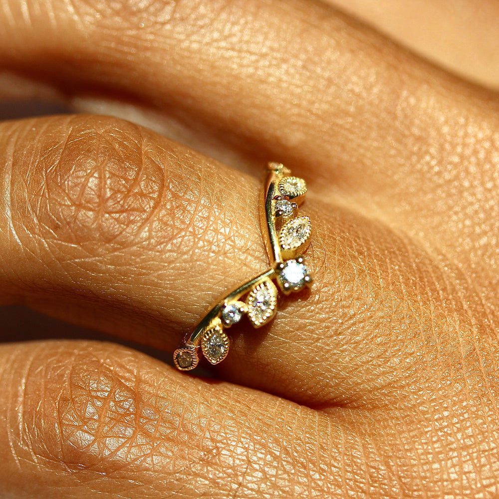 Hand wearing diamond v-band with marquise and round lab-grown diamonds