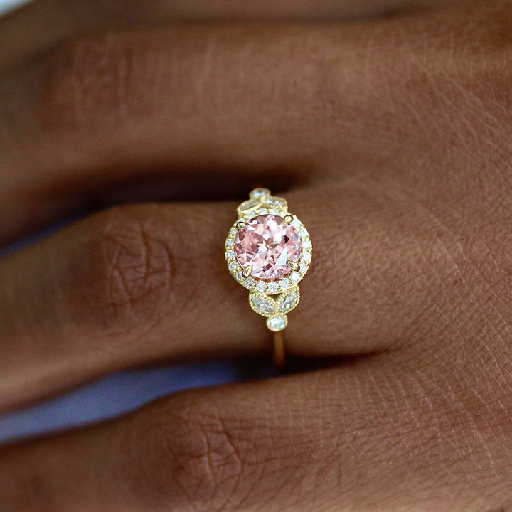 The Cate Ring (Round) in Yellow Gold and Peachy-Pink Created Sapphire modeled