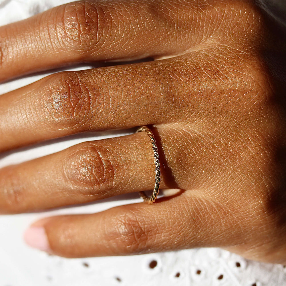 The Dainty Twist Stacking Ring in Yellow Gold modeled
