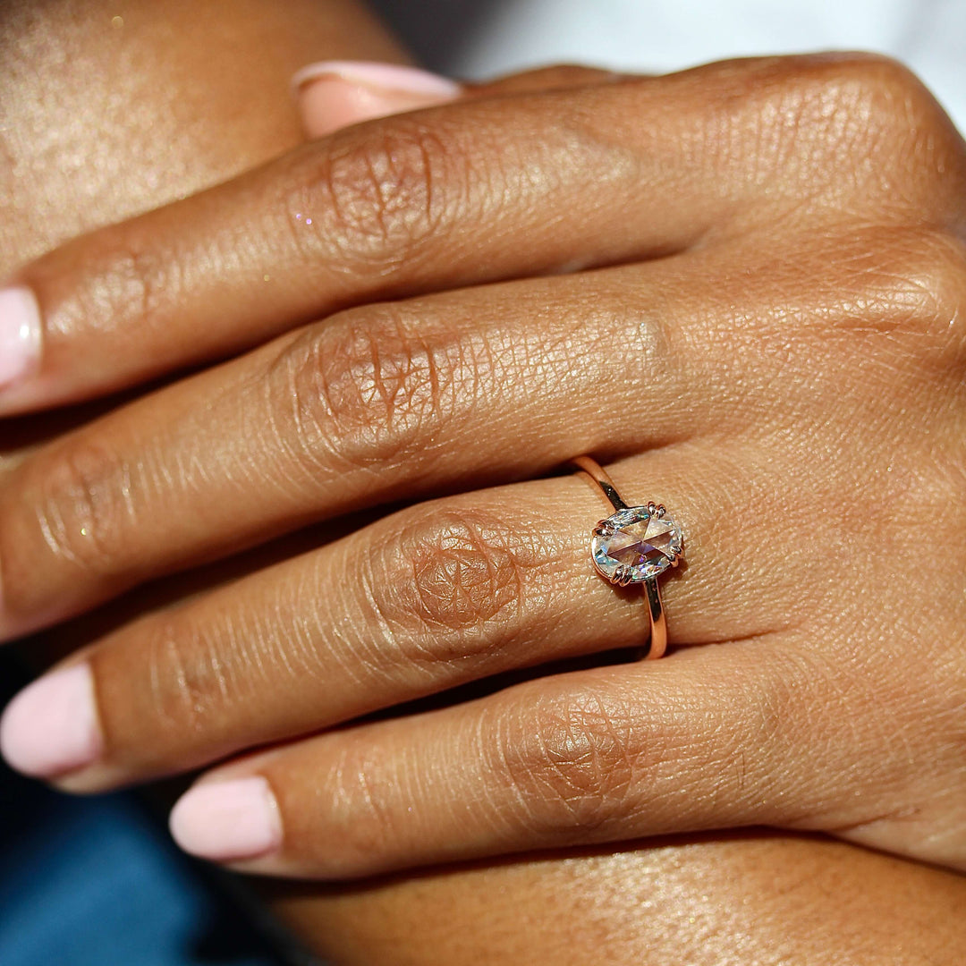 The Nora Ring (Oval) in Rose Gold modeled on a hand