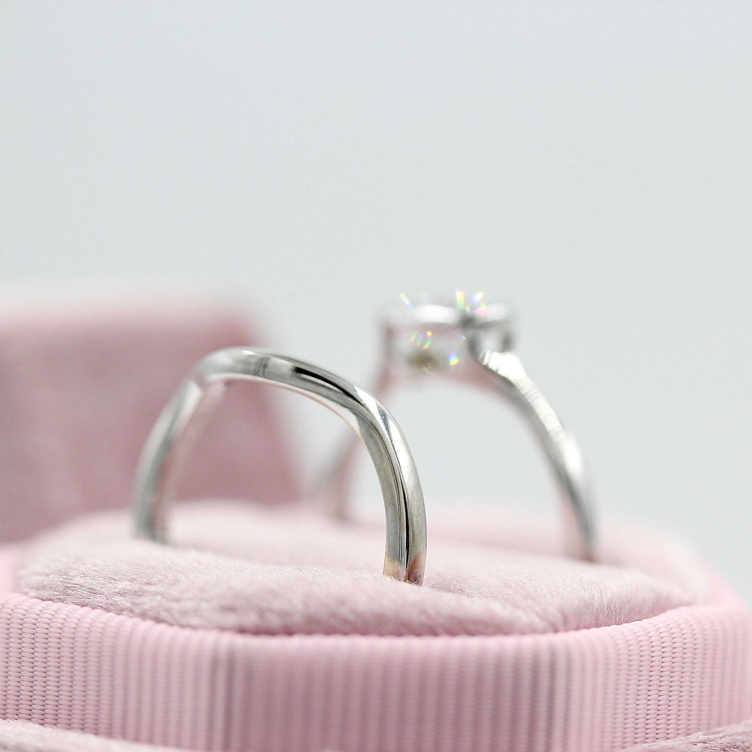 The Wave Wedding Band in White Gold with the Stevie Ring East-West Oval in White Gold in a pink velvet ring box