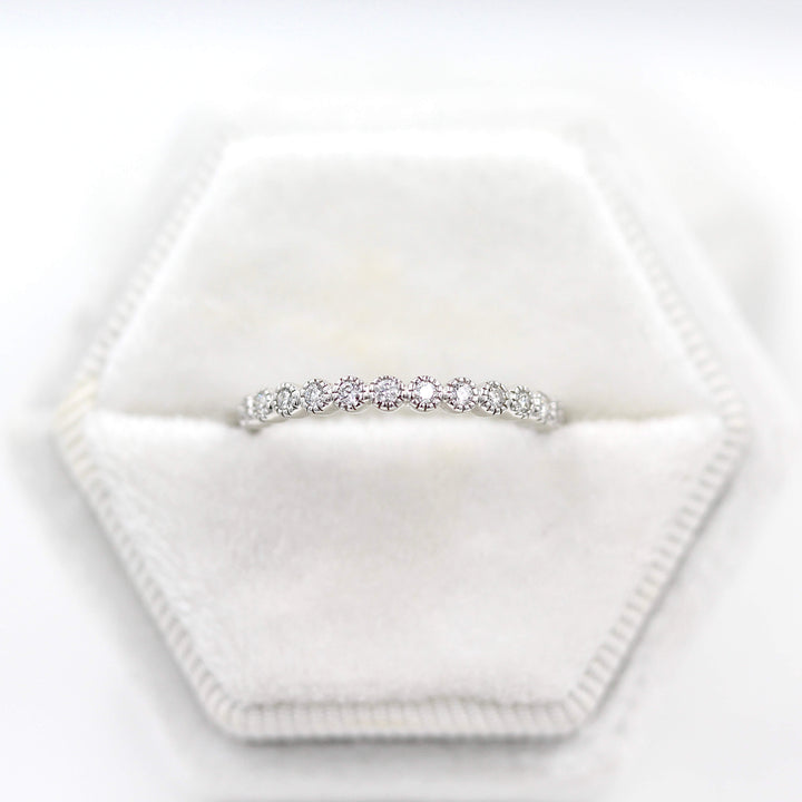 The Florence Wedding Band in white gold in a white velvet ring box