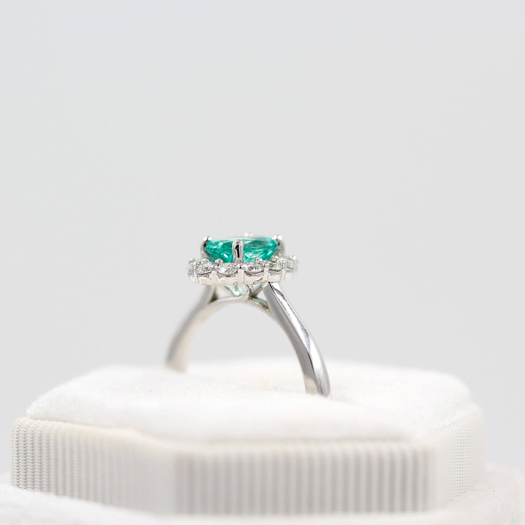 The Ava Ring with Minty Green Paraiba Color Chrysoberyl in white gold in a white velvet ring box