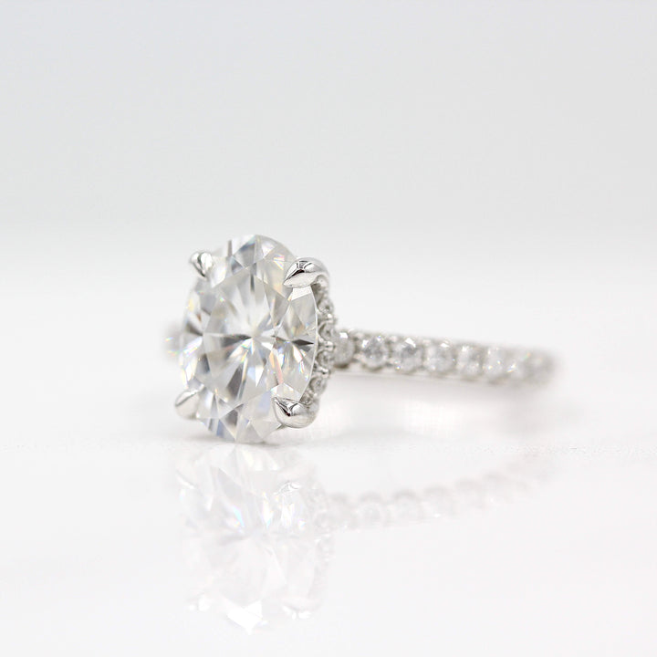 The Athena Hidden Halo Ring (Oval) in White Gold and Moissanite against a white background
