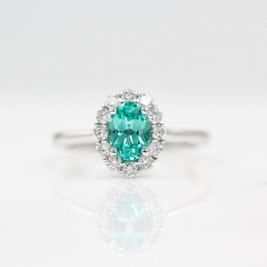 The Ava Ring with Minty Green Paraiba Color Chrysoberyl in white gold against a white background