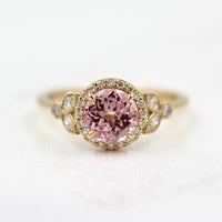 The Cate Ring (Round) in Yellow Gold and Peachy-Pink Created Sapphire against a white background