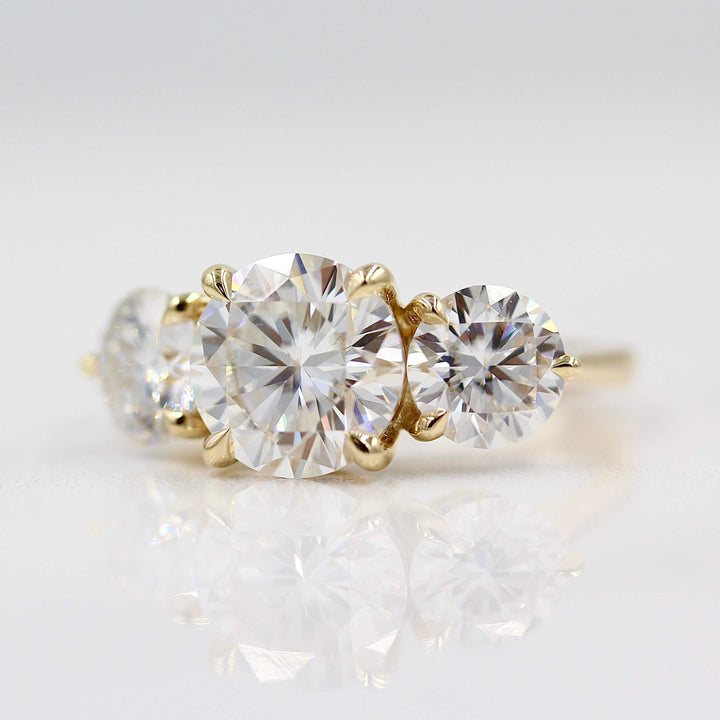 The Corrinne Hidden Halo Ring in Yellow Gold against a white background