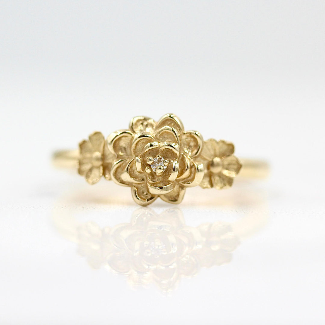 The Posy Ring in Yellow Gold against a white background
