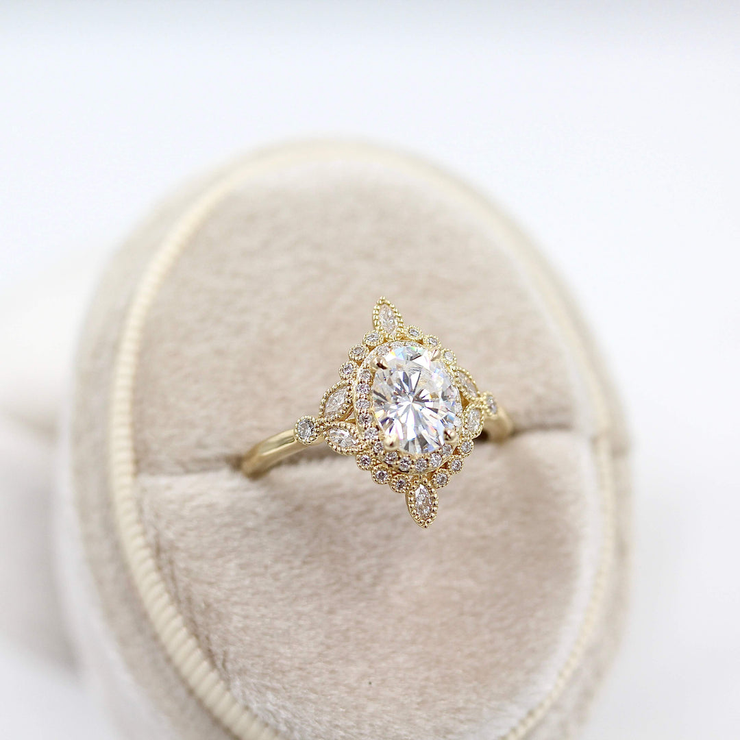 The Stella ring in Yellow Gold in a white velvet ring box