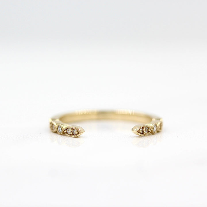 The Open Charlotte Wedding Band in Yellow Gold against a white background