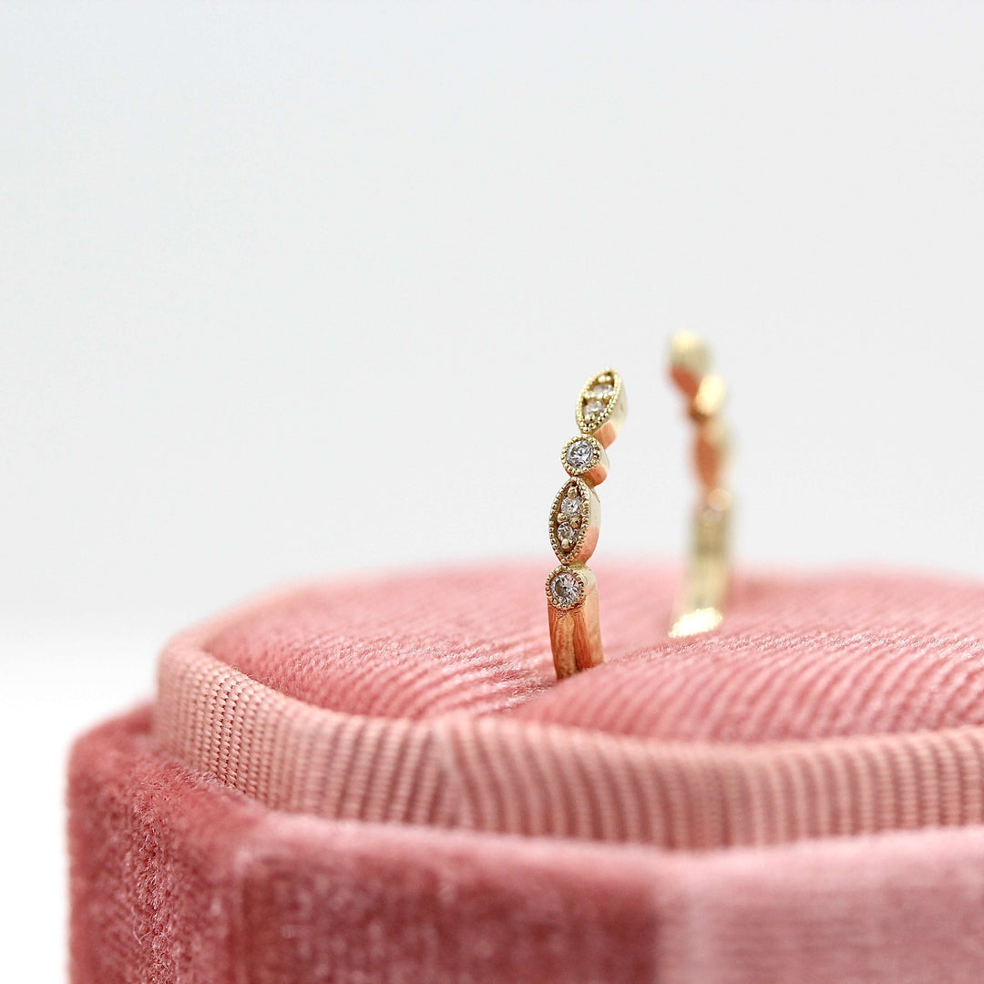 The Open Charlotte Wedding Band in Yellow Gold in a pink velvet ring box