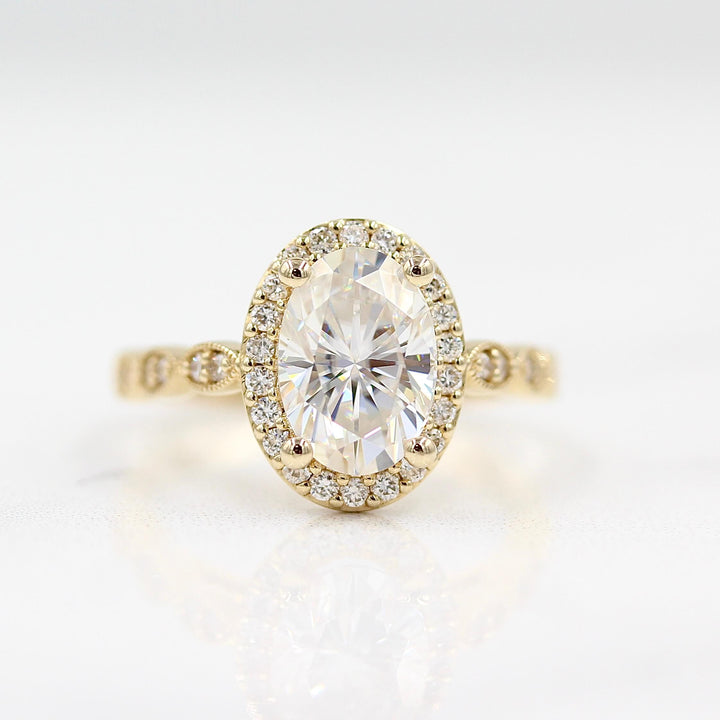 The Isla Ring (Oval) in Yellow Gold and Moissanite against a white background