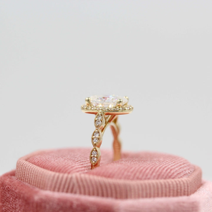 The Isla Ring (Oval) in Yellow Gold in a pink velvet ring box