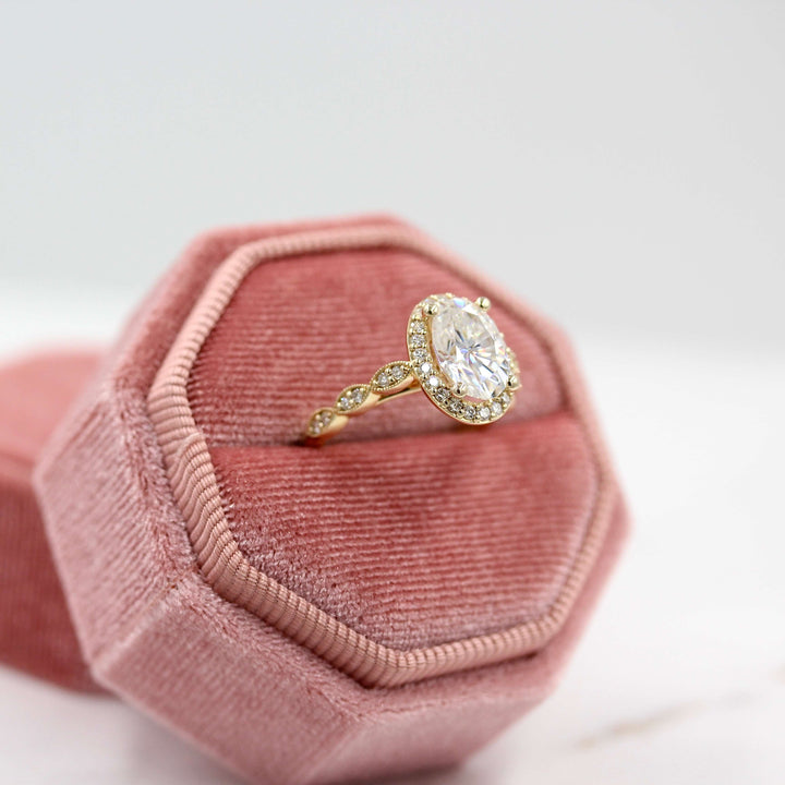 The Isla Ring (Oval) in Yellow Gold in a pink velvet ring box