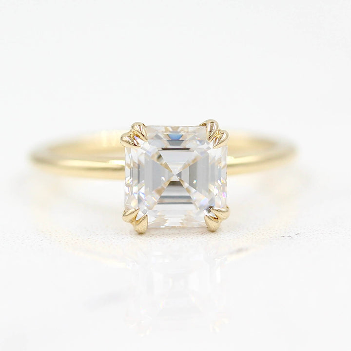 The Serena Ring (Asscher) in Yellow Gold against a white background