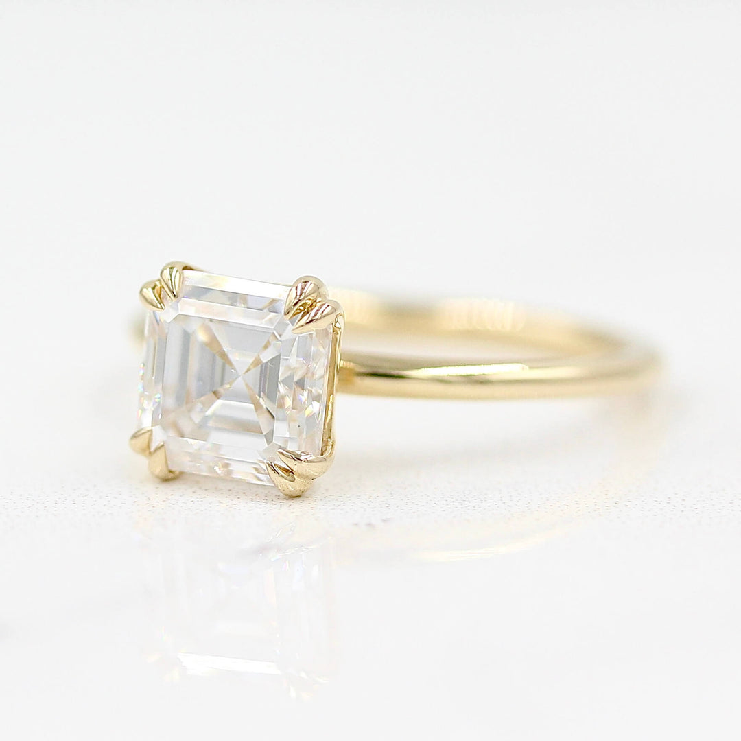 The Serena Ring (Asscher) in Yellow Gold against a white background