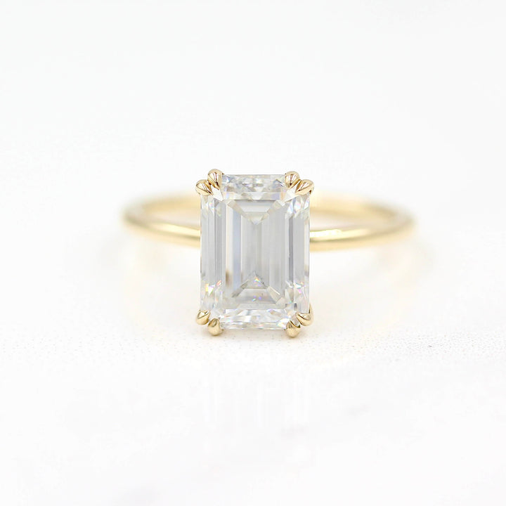 The Serena Ring (Emerald) in Yellow Gold against a white background