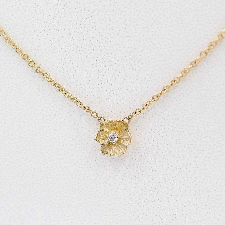 The Poppy Necklace in Yellow Gold against a white background