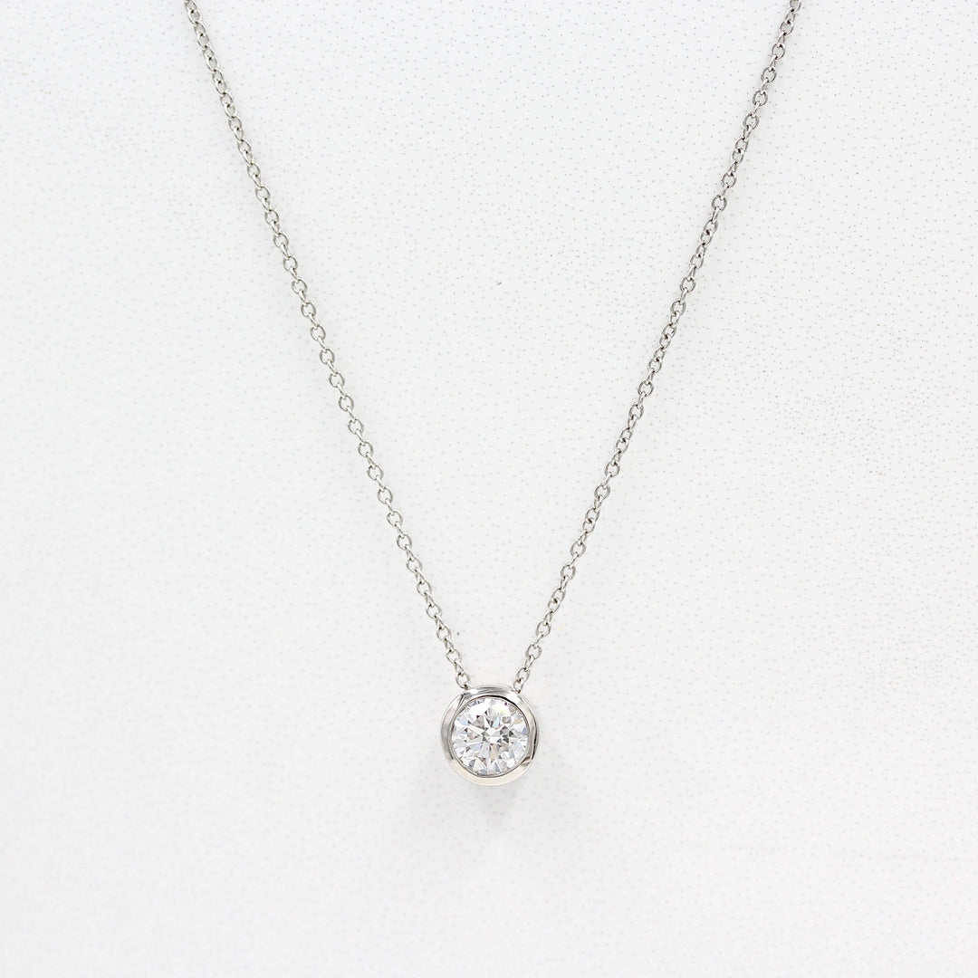 1/2ct Diamond Bezel Necklace in White Gold against a white background