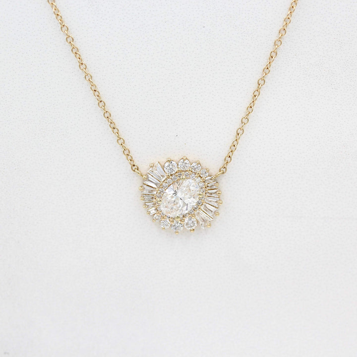The Soleil Pendant in yellow gold against a white background