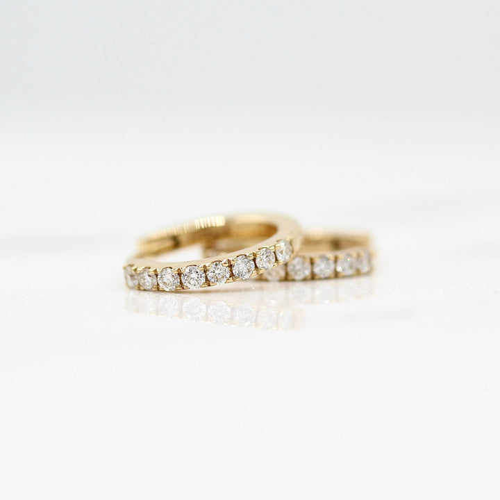 12mm Diamond Huggies in Yellow Gold against a white background