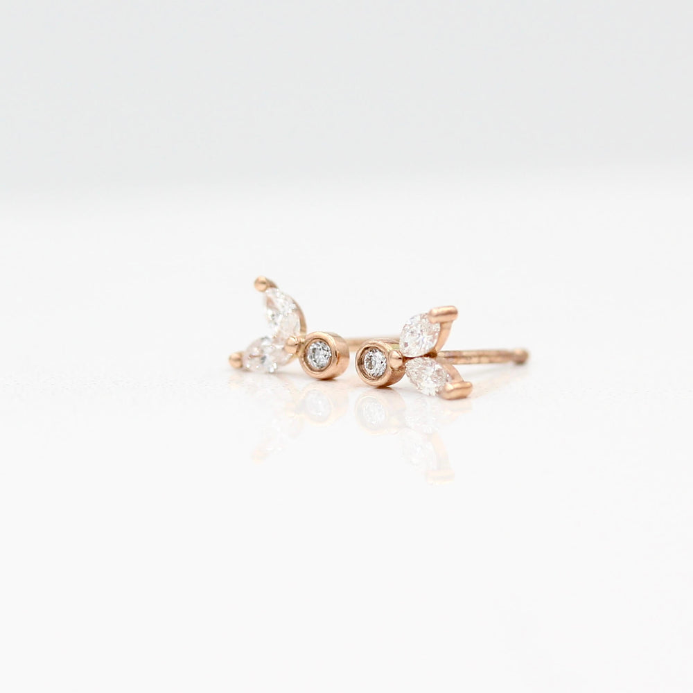 The Sophia Earrings in rose gold against a white background