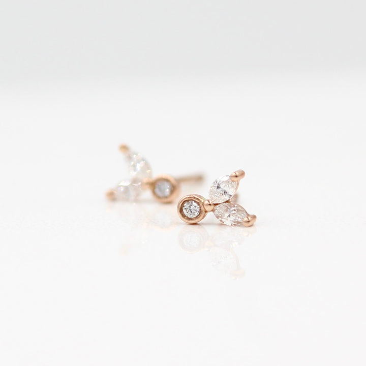 The Sophia Earrings in rose gold against a white background