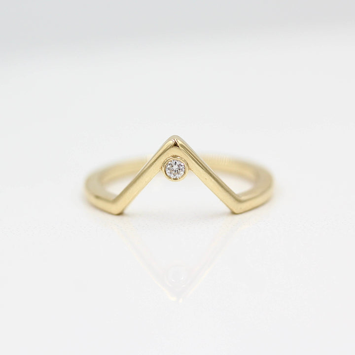 The Single Diamond V-Band in Yellow Gold against a white background