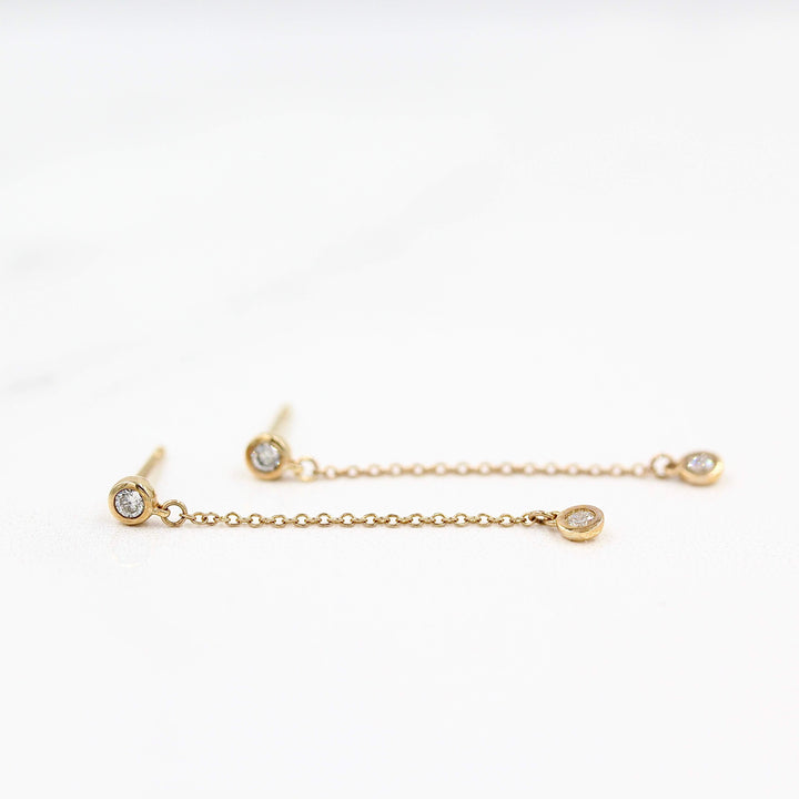 The Diamond Drop Earrings in Yellow Gold against a white background