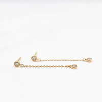 The Diamond Drop Earrings in Yellow Gold against a white background