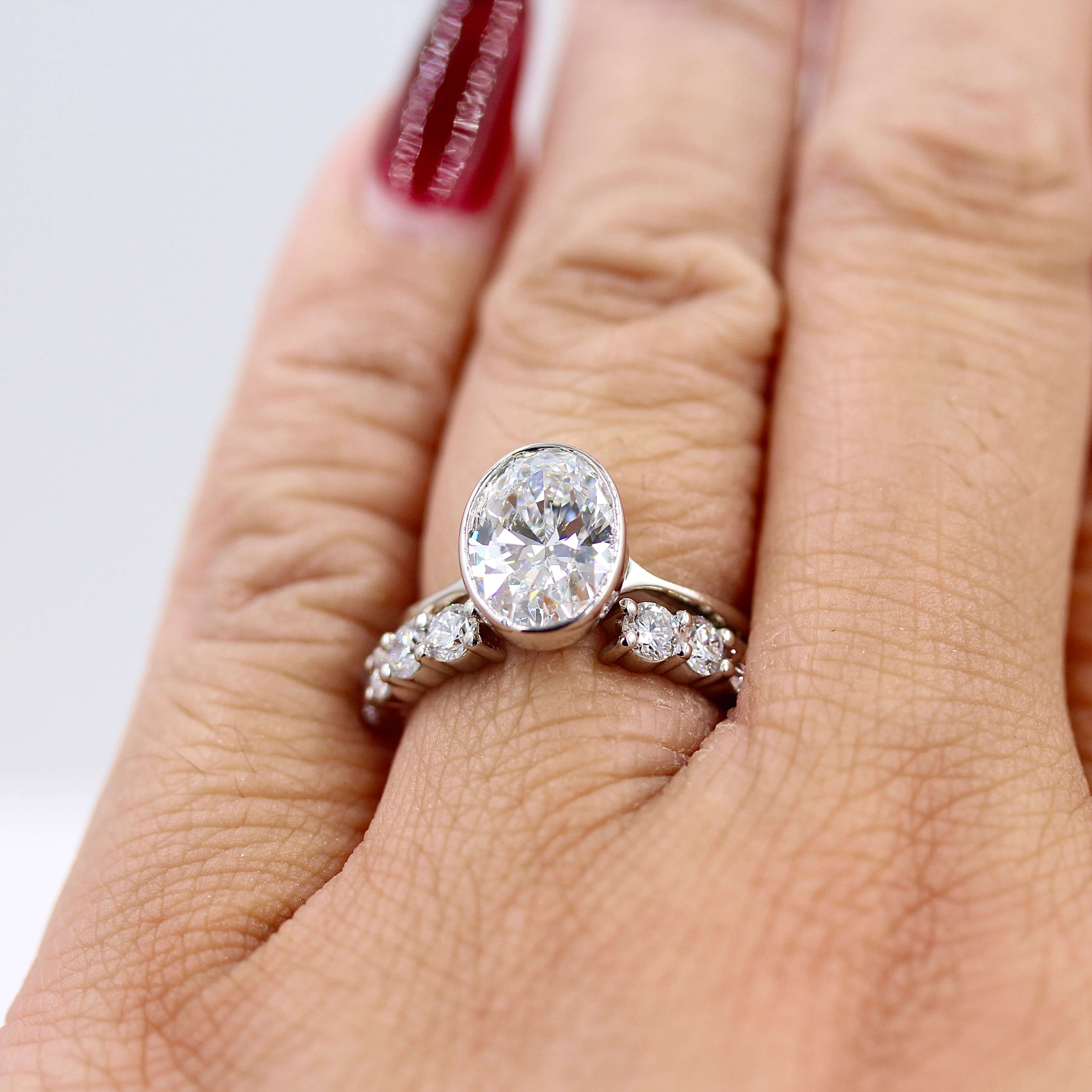 Oval bezel set engagement ring deals
