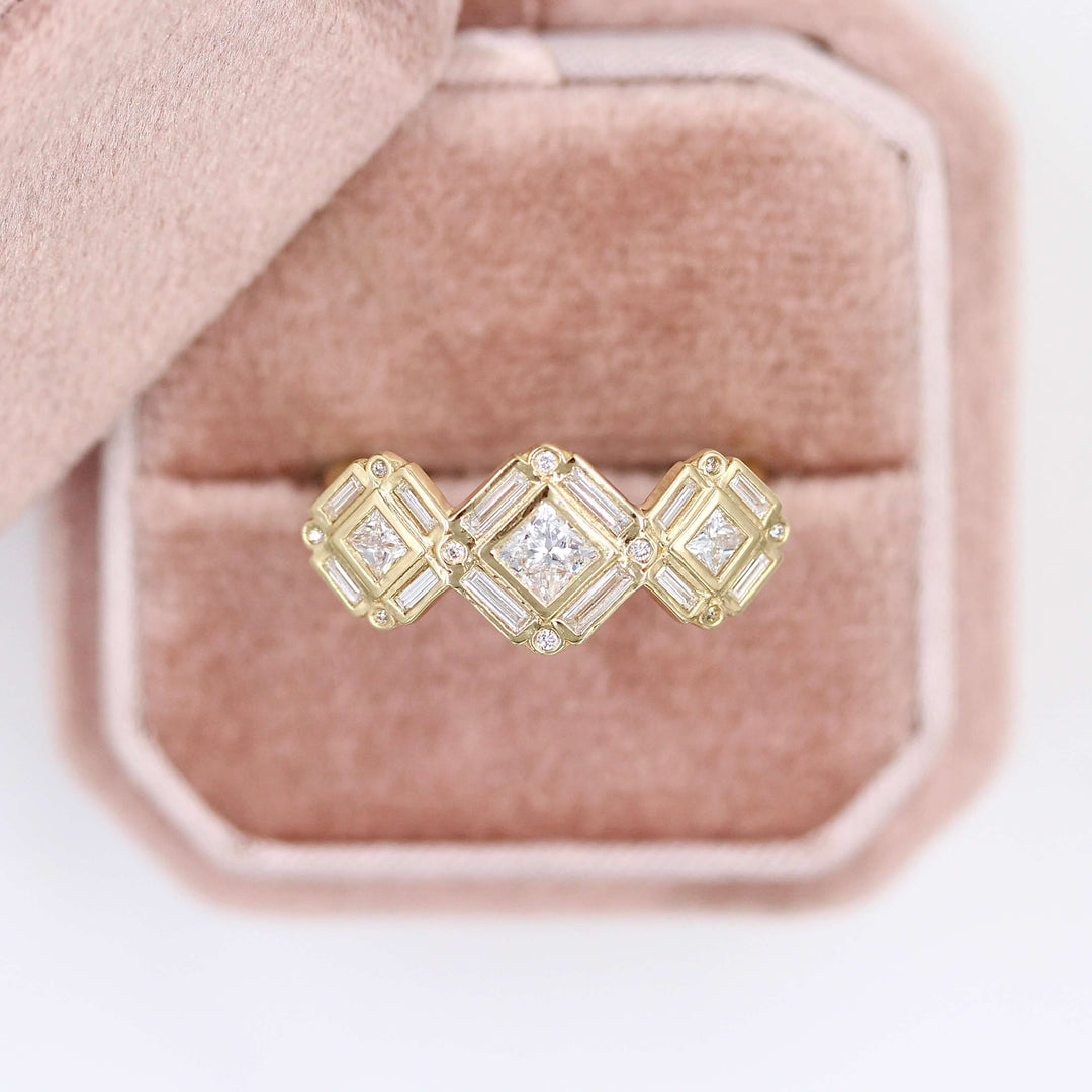 The Darby Ring in yellow gold in a pink velvet ring box